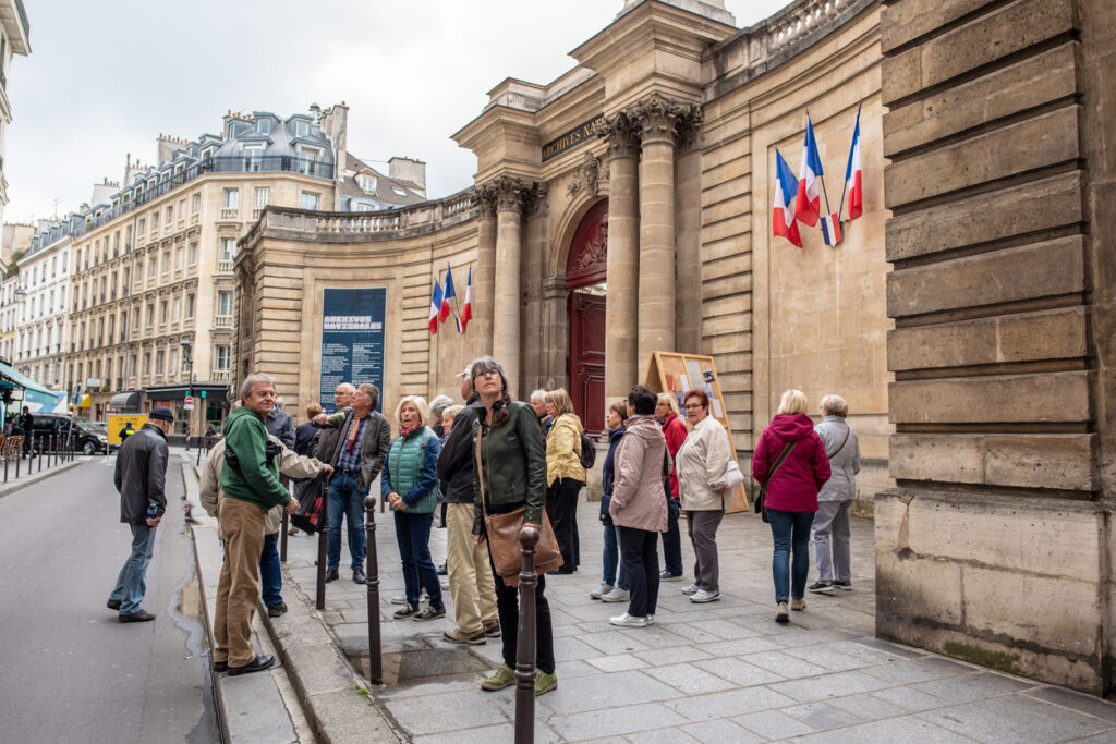 tourists on a guided tour in marais in paris